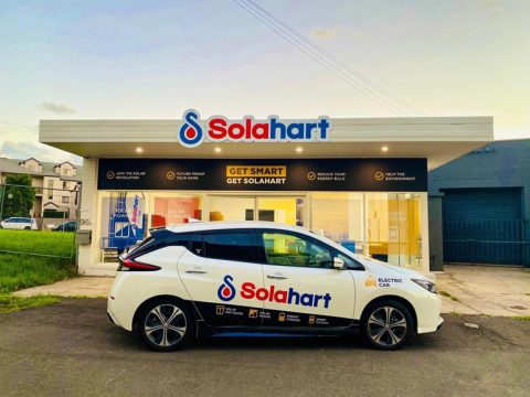 Nissan Leaf with Solahart logos parked in front of the Solahart Wollongong office